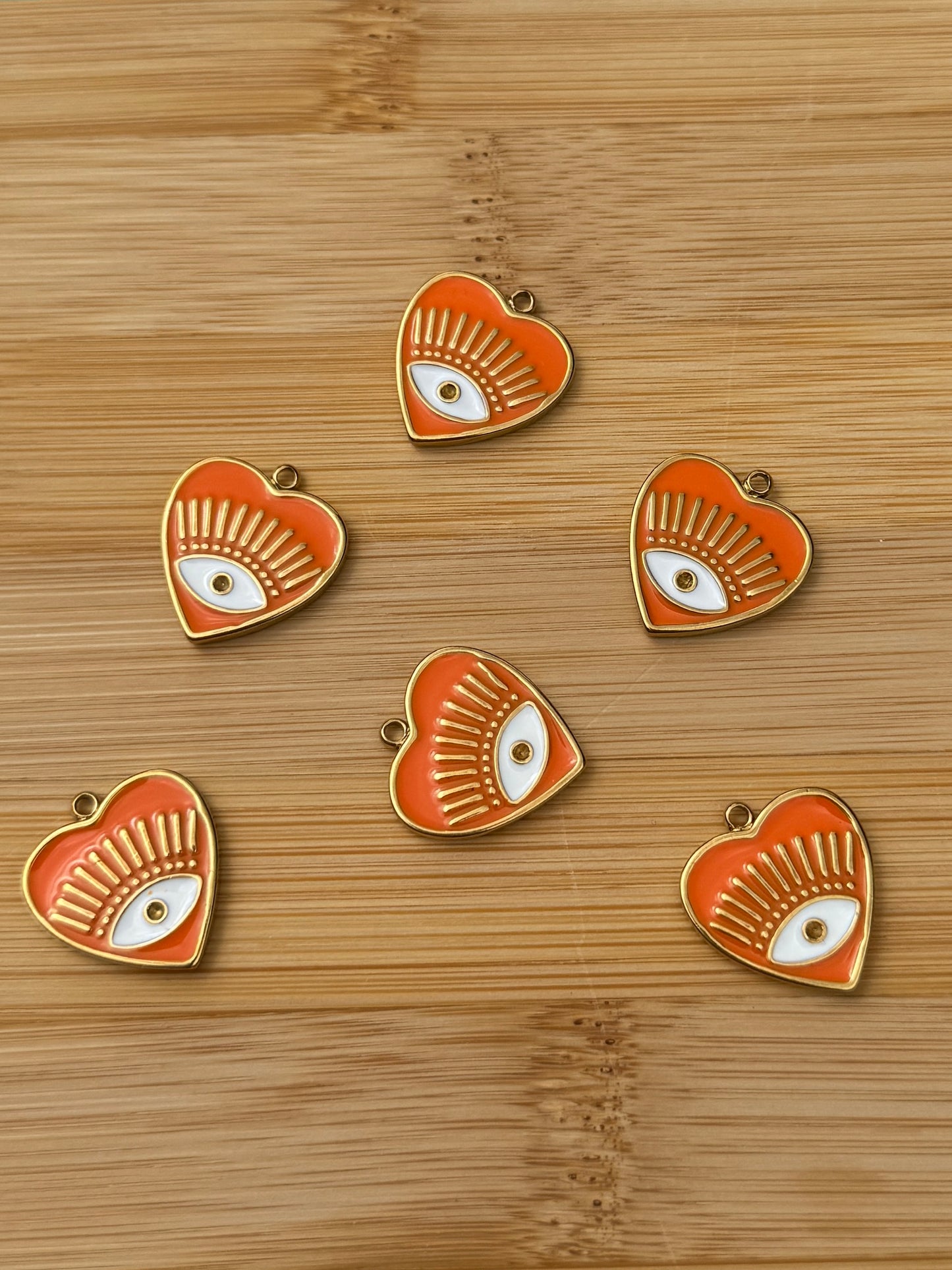 Pendentif regard orange